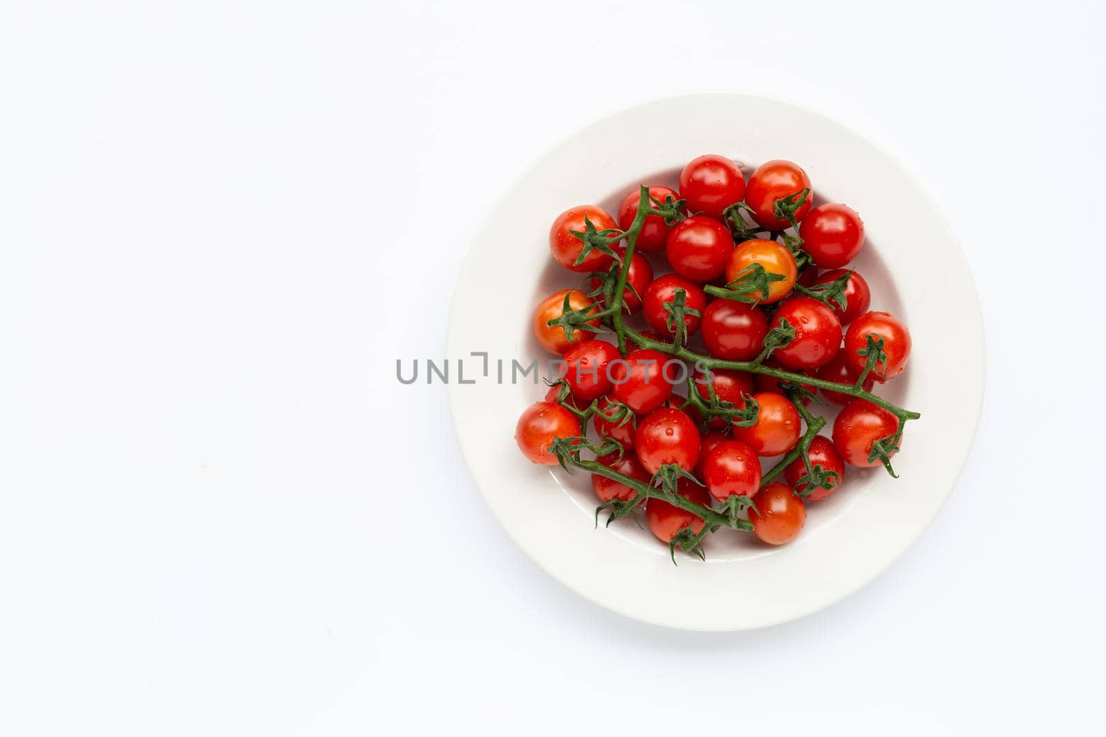 Fresh tomatoes on white background.
