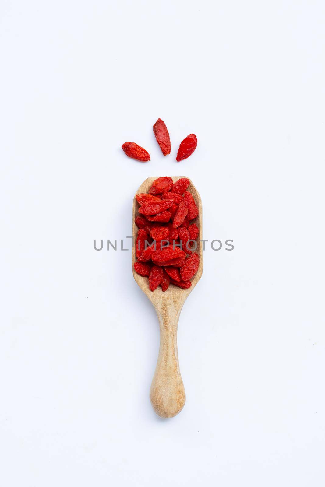 Dried goji berries on white background. Top view