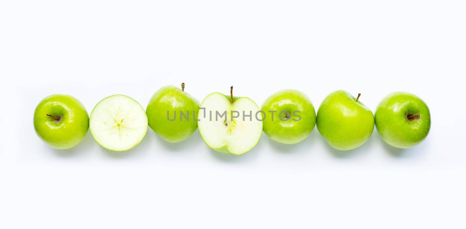 Green apples on white background. Copy space by Bowonpat