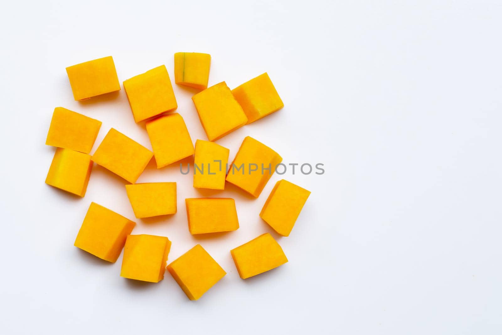 Cut and slices butternut squash on white background.
