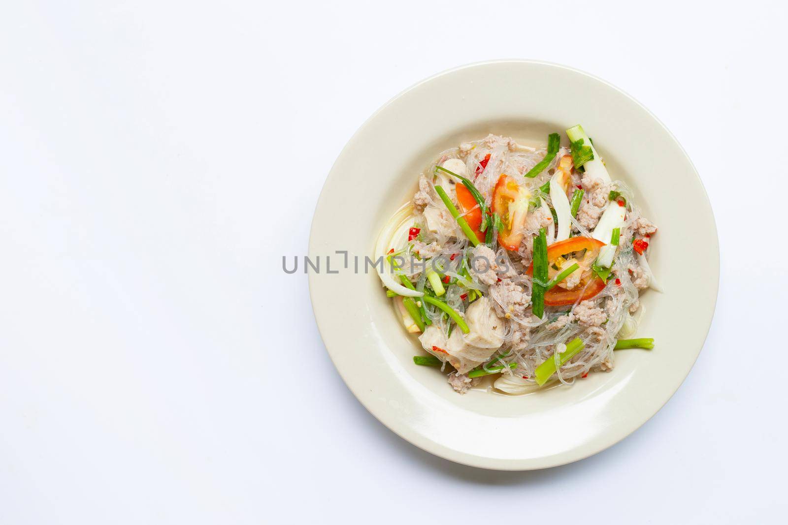 Spicy glass noodle salad with pork . Top view