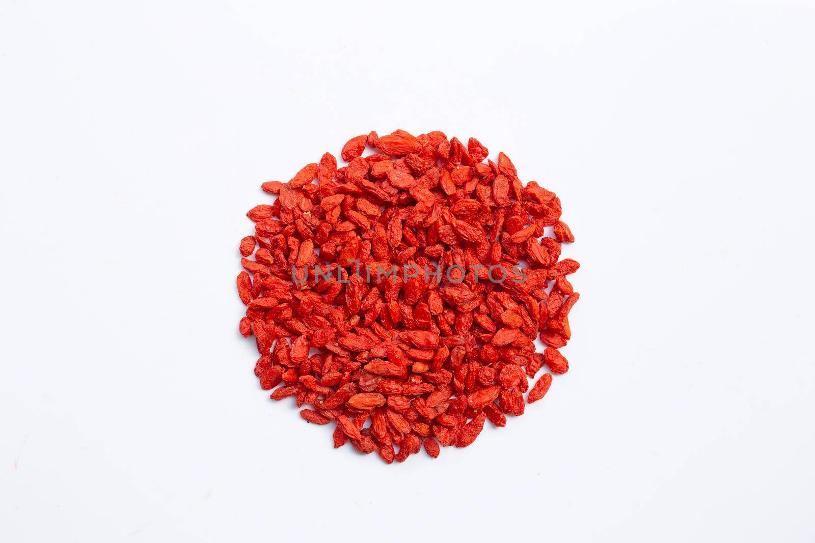 Dried goji berries on white background. Top view