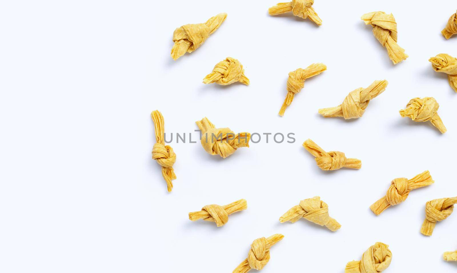 Dried bean curd knot on white background. Copy space