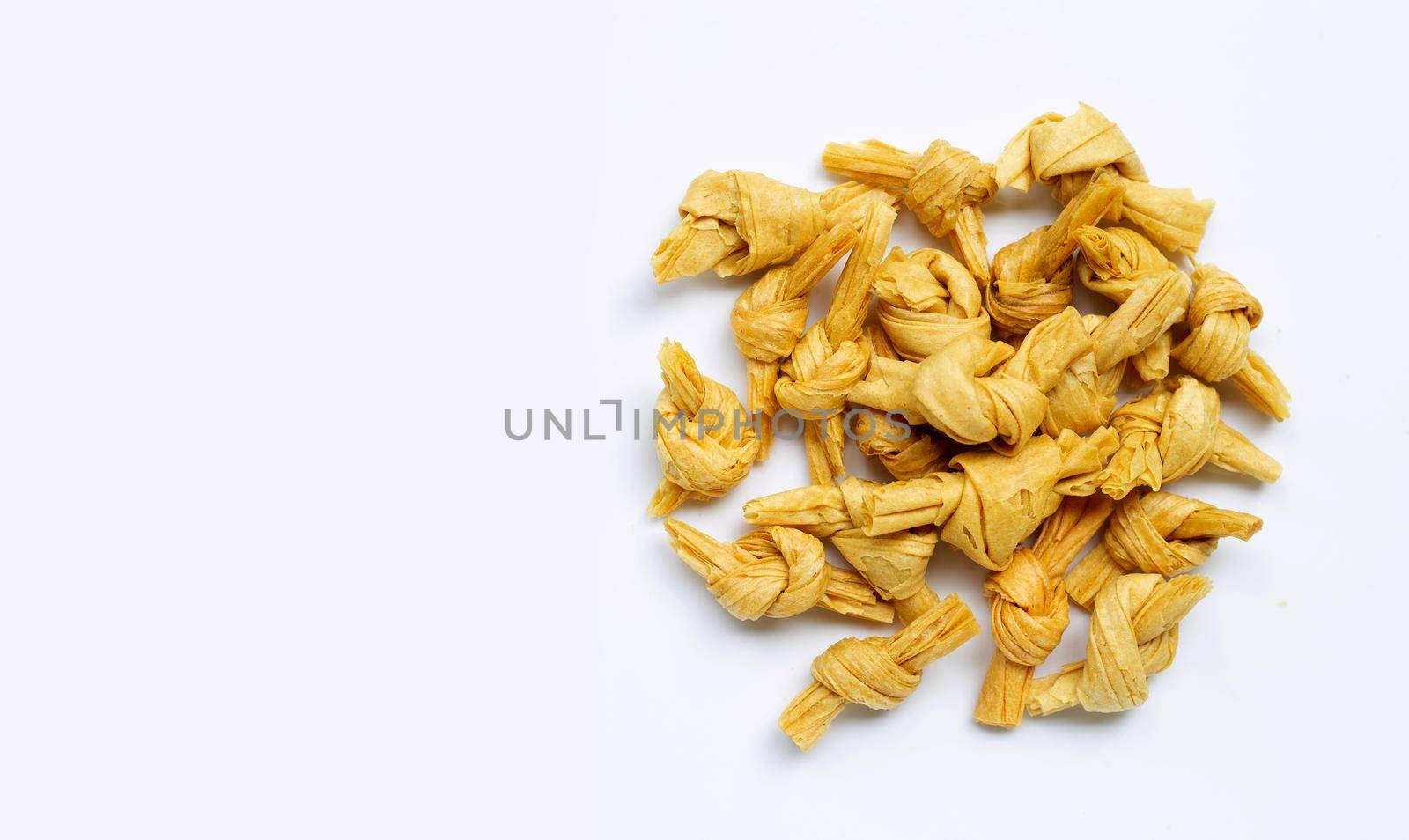 Dried bean curd knot on white background. Copy space