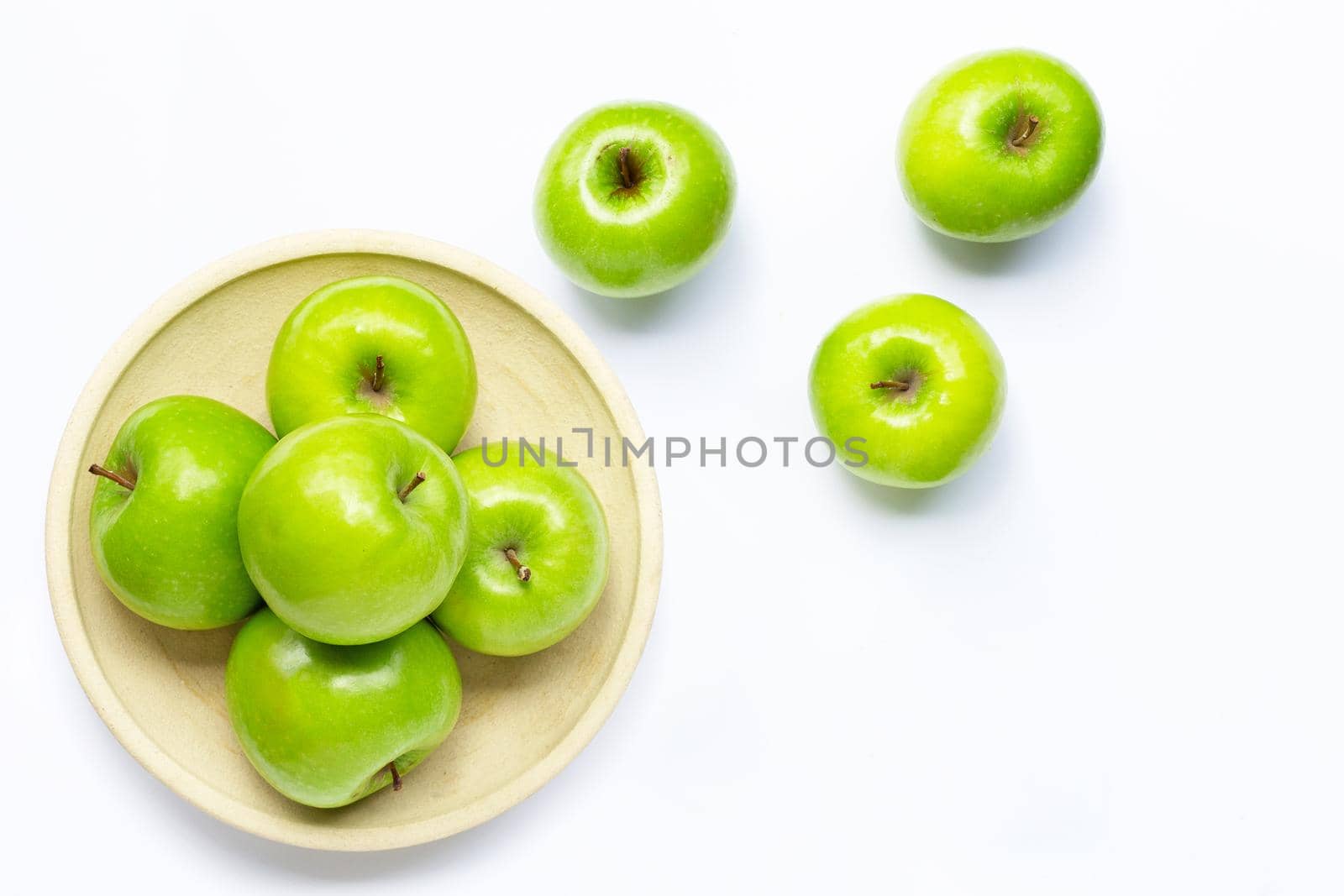 Green apples on white background. Copy space