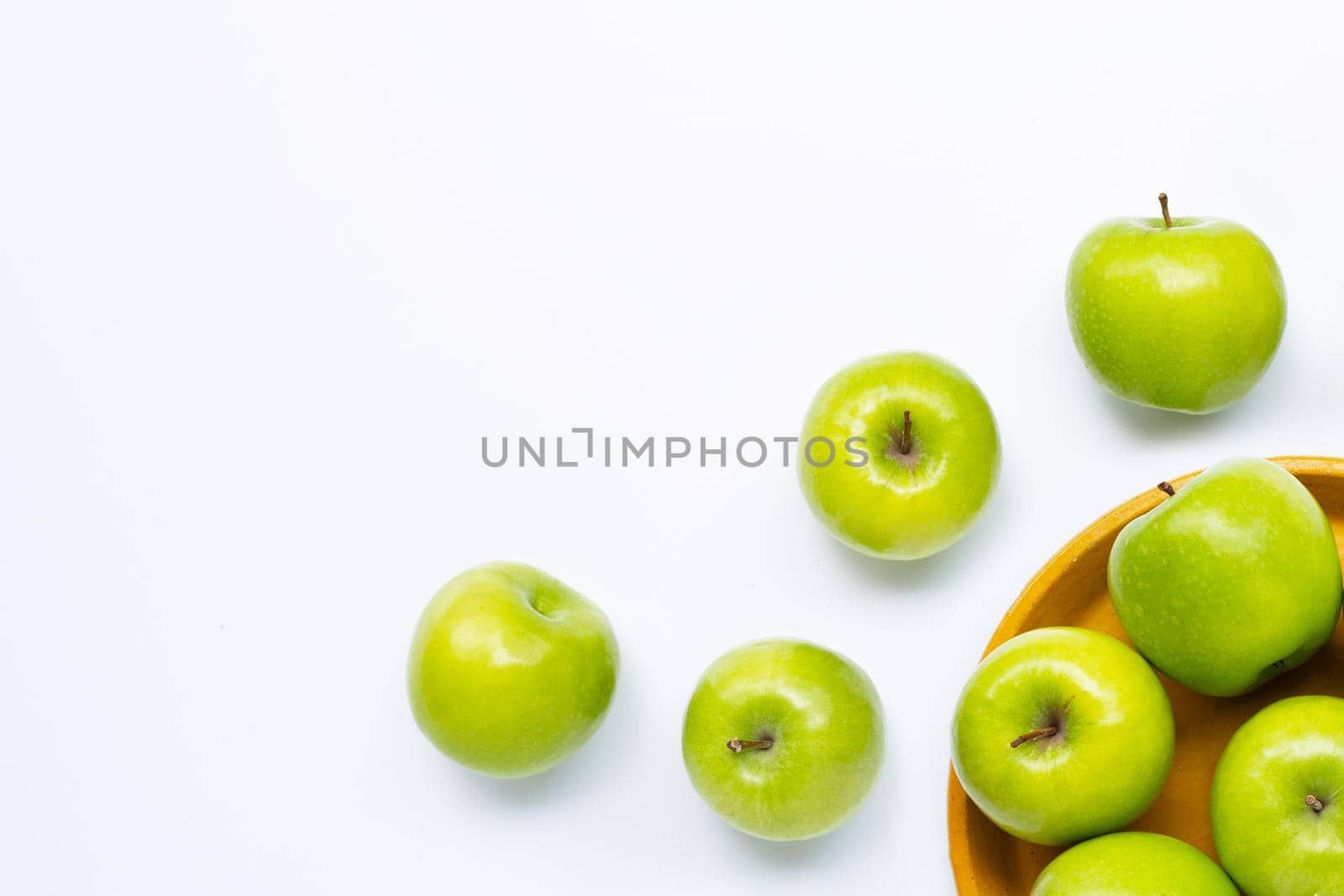 Green apples on white background. Copy space