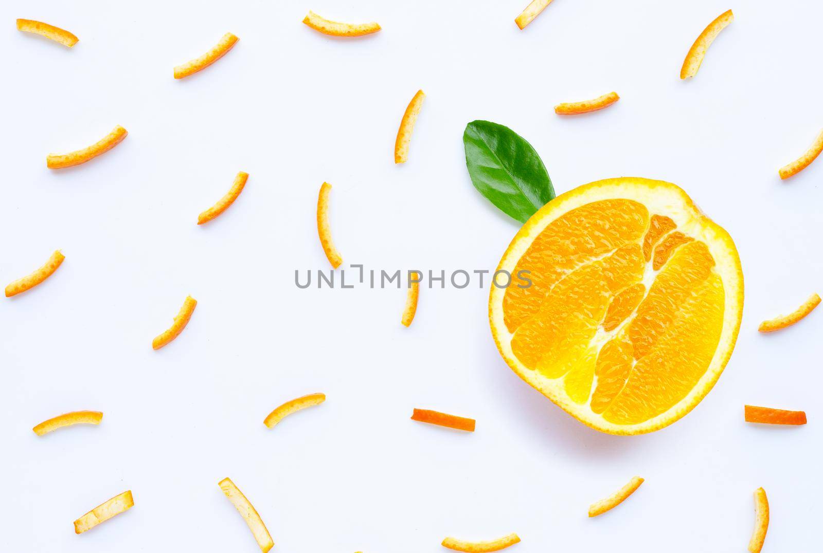 Orange peels slices on white background. top view