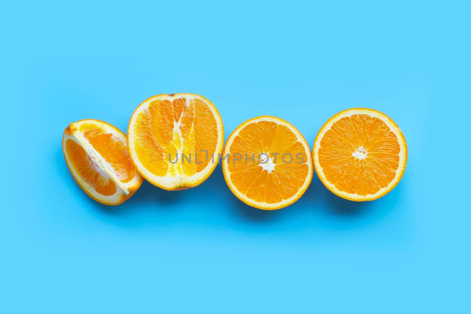 High vitamin C, Juicy and sweet. Fresh orange fruit  on blue background. Top view