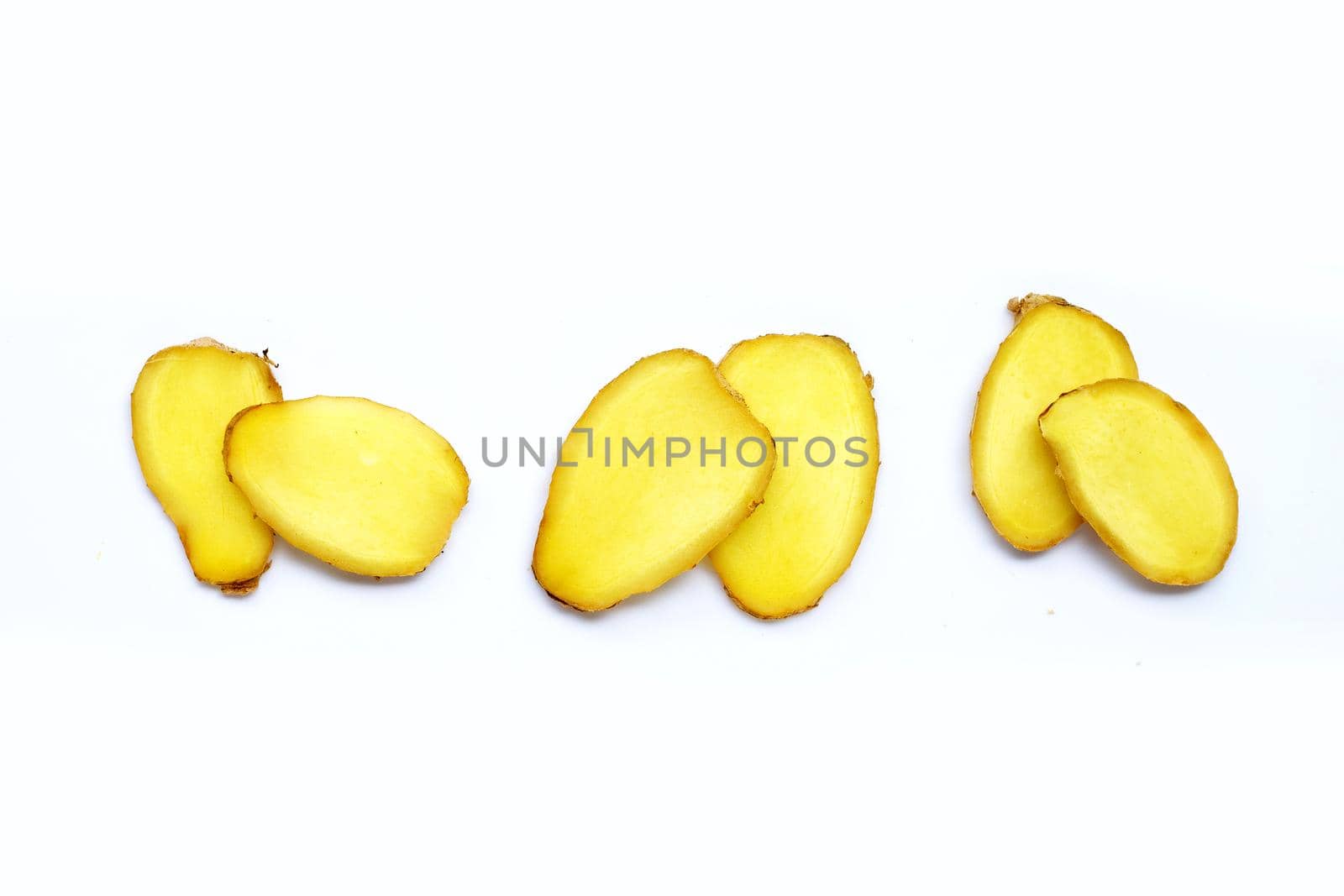 Ginger slices on white background.