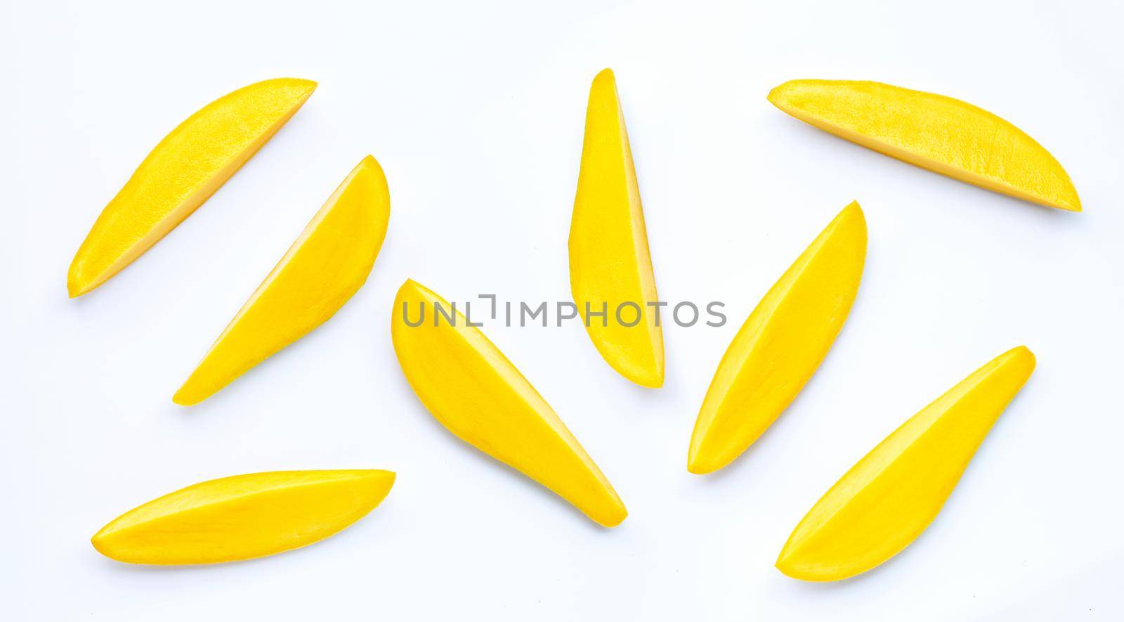 Tropical fruit, Mango slices on white background. Top view