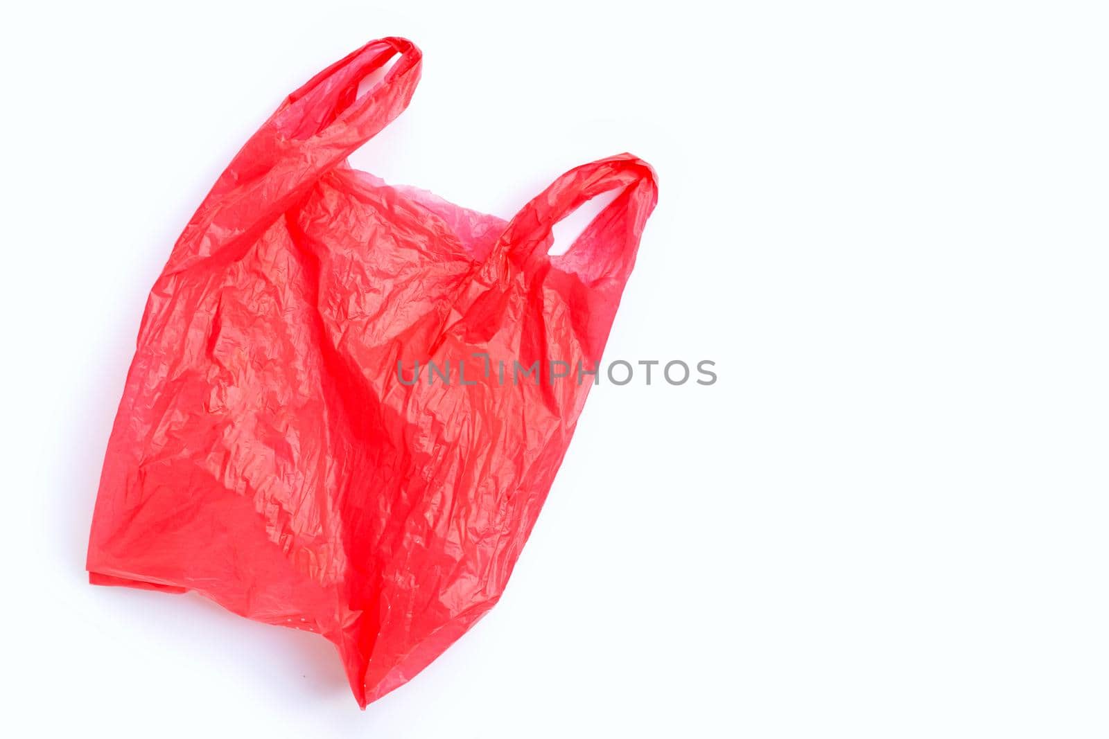 Colorful plastic bags on white background. Copy space