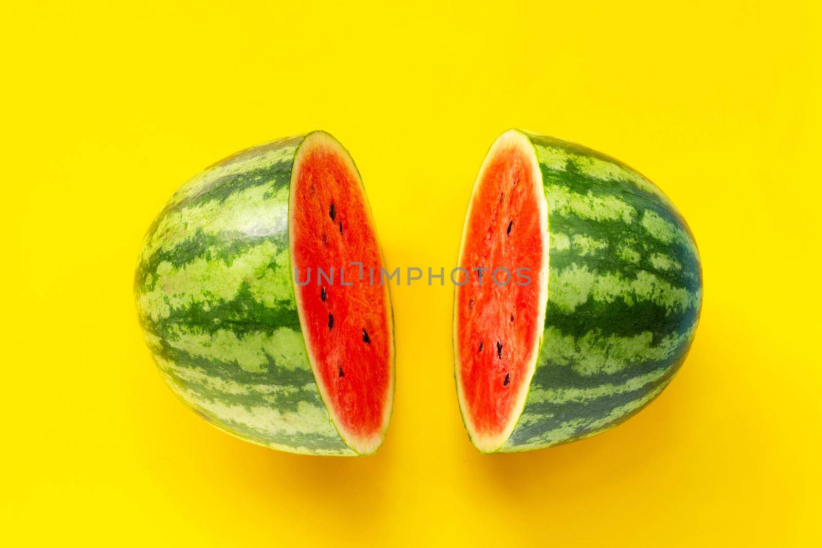 Watermelon on yellow background. Top view