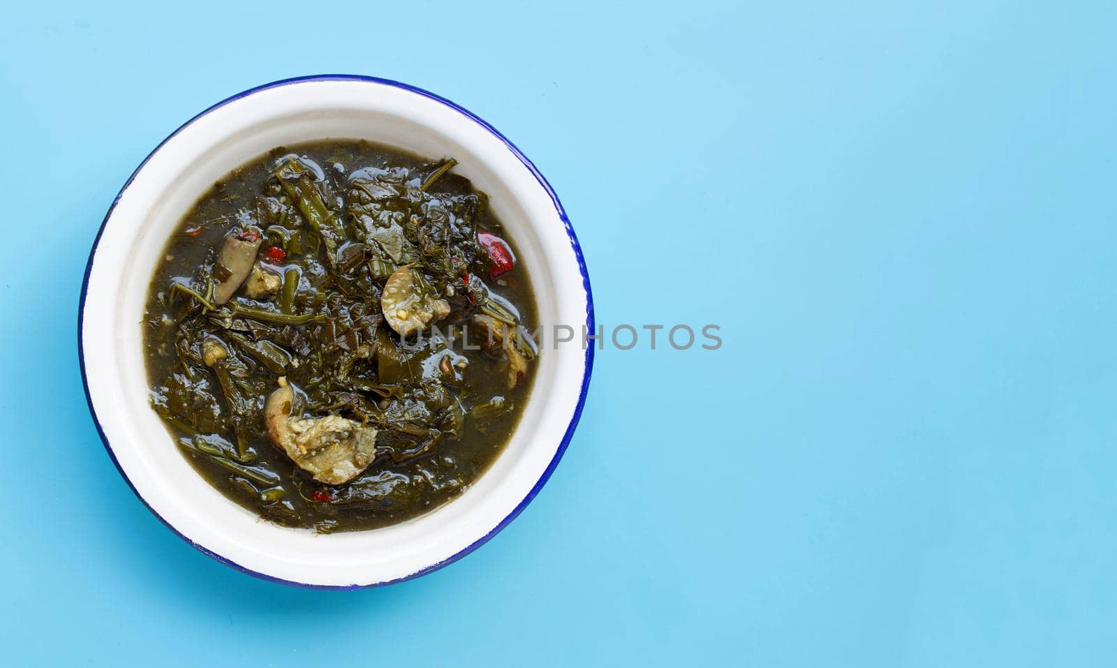 Cassia curry with pork on blue background. Thai food