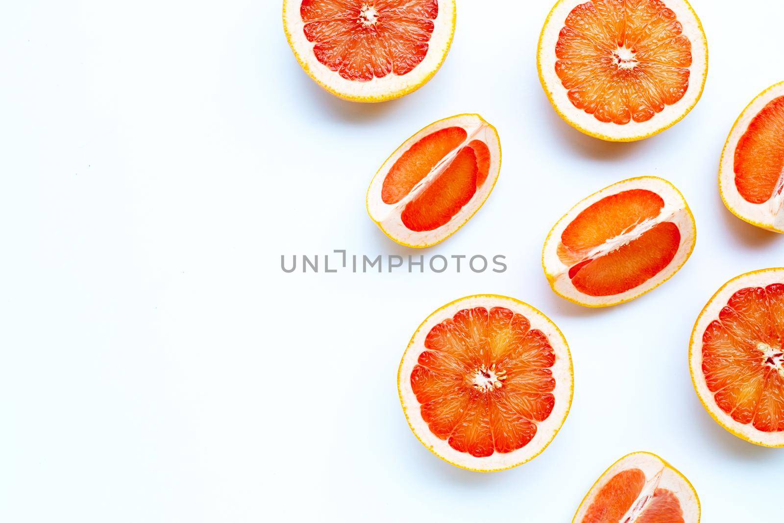 High vitamin C. Juicy grapefruit on white background.
