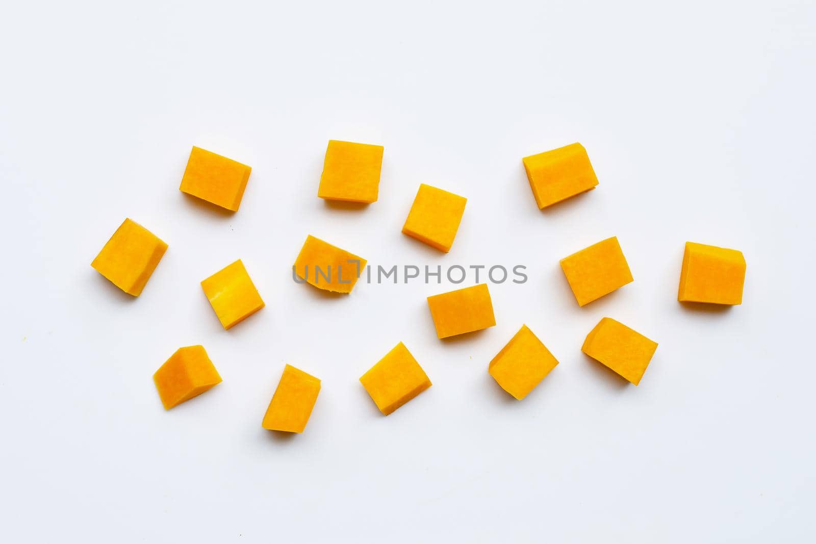Cut and slices butternut squash on white background.