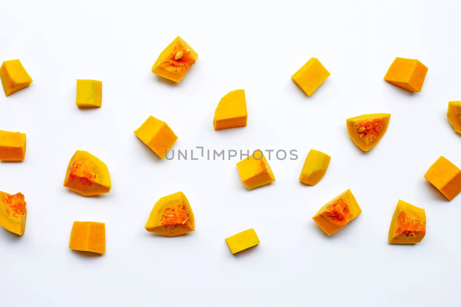 Cut and slices butternut squash on white background.