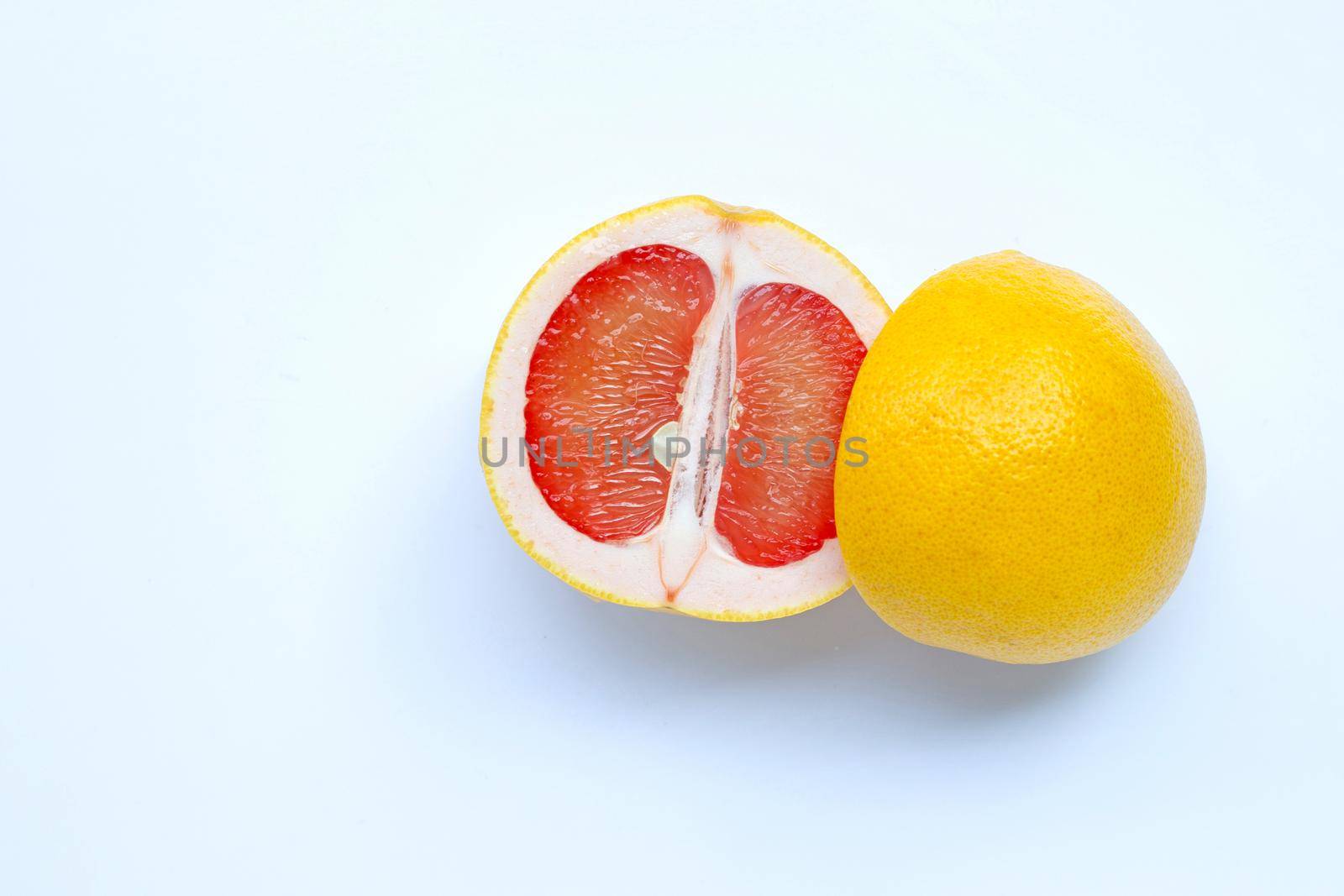 High vitamin C. Juicy grapefruit on white background.