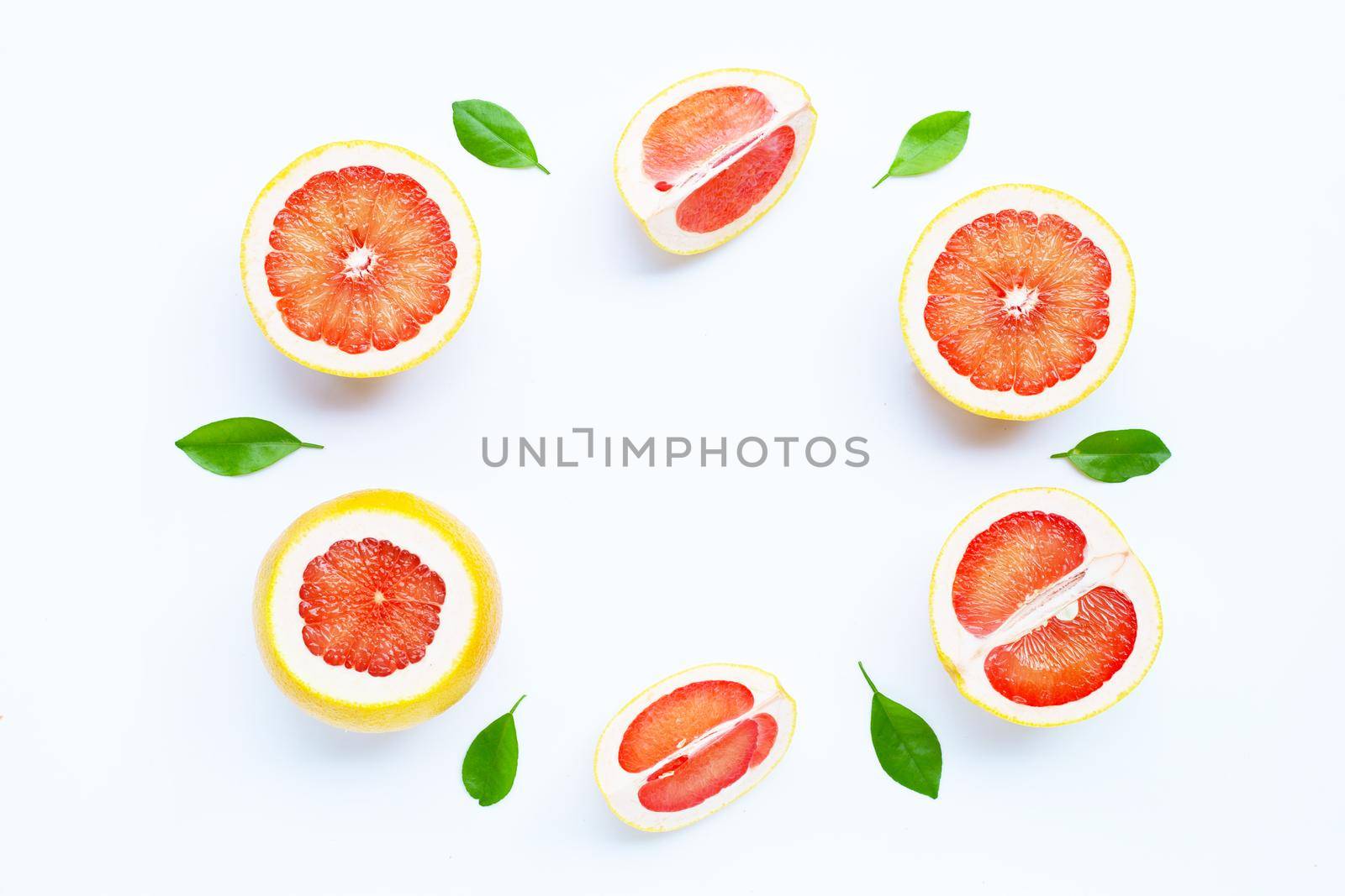 High vitamin C. Frame made of Juicy grapefruit on white background.
