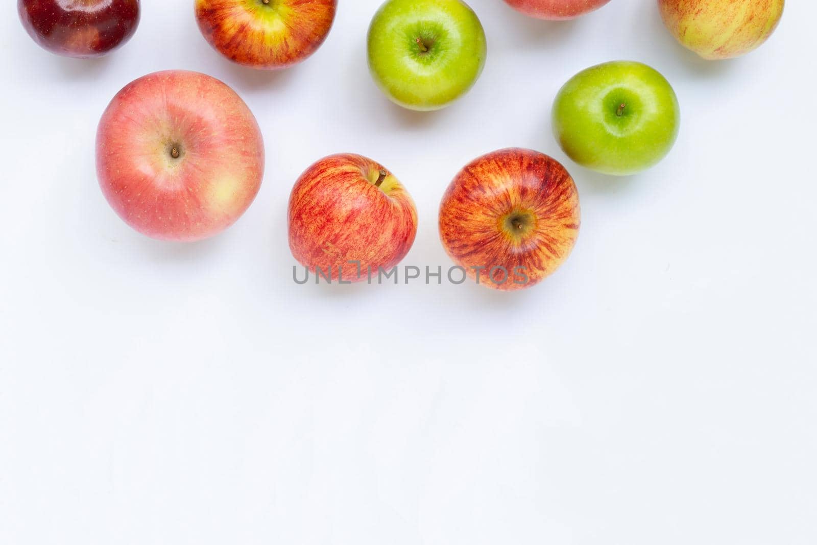 Fresh juicy apples on white background. Copy space