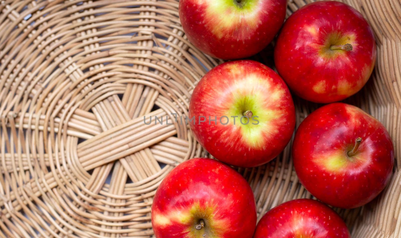 Juicy red apples in a basket