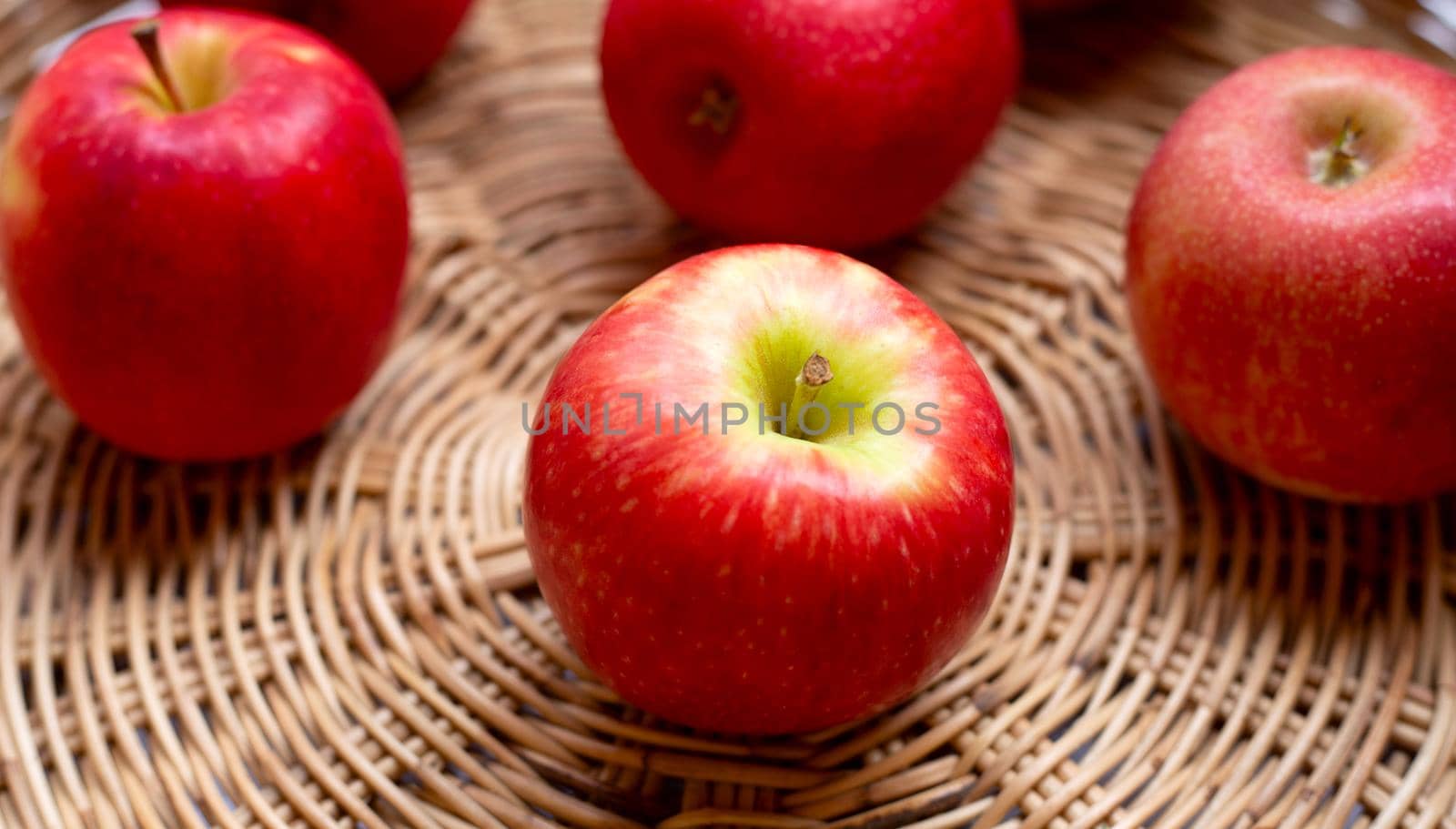 Juicy red apples in a basket