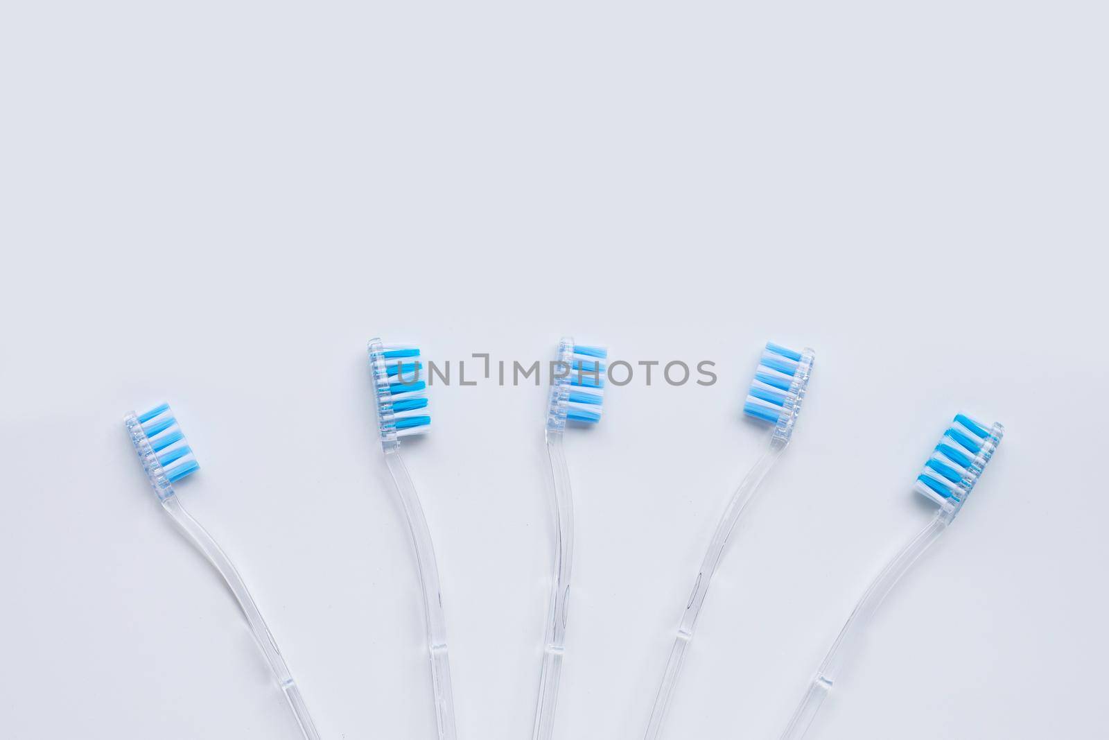 Toothbrushes on white background. Top view