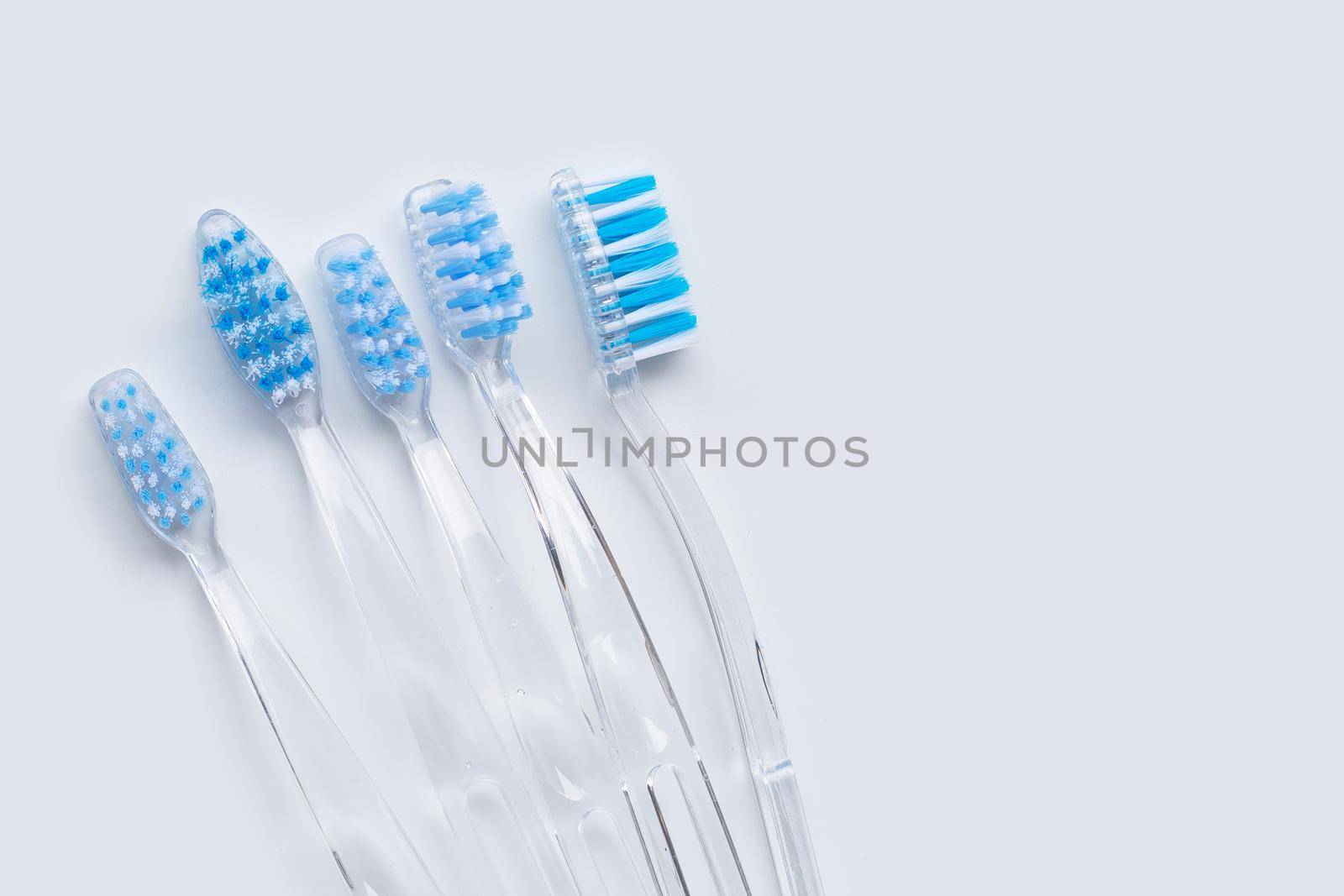 Toothbrushes on white background. Top view by Bowonpat