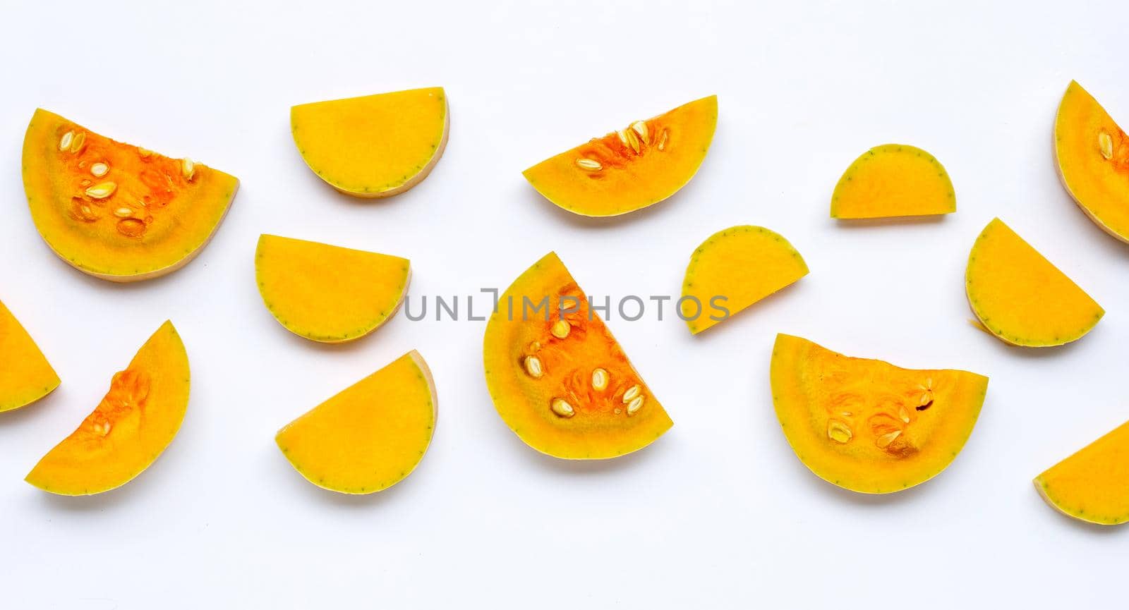 Cut and slices butternut squash on white background.