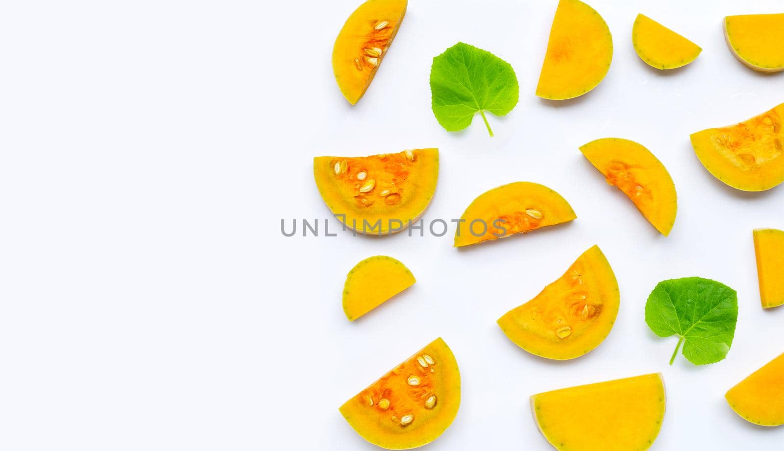 Butternut squash slices on white background. Copy space
