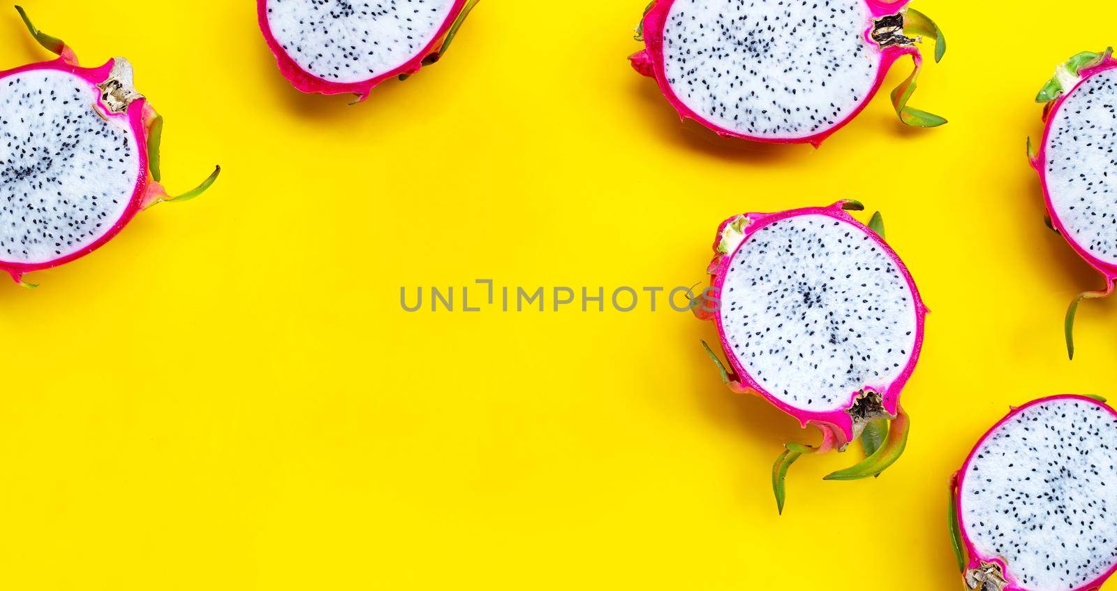 Pitahaya or dragonfruit on yellow background. Copy space
