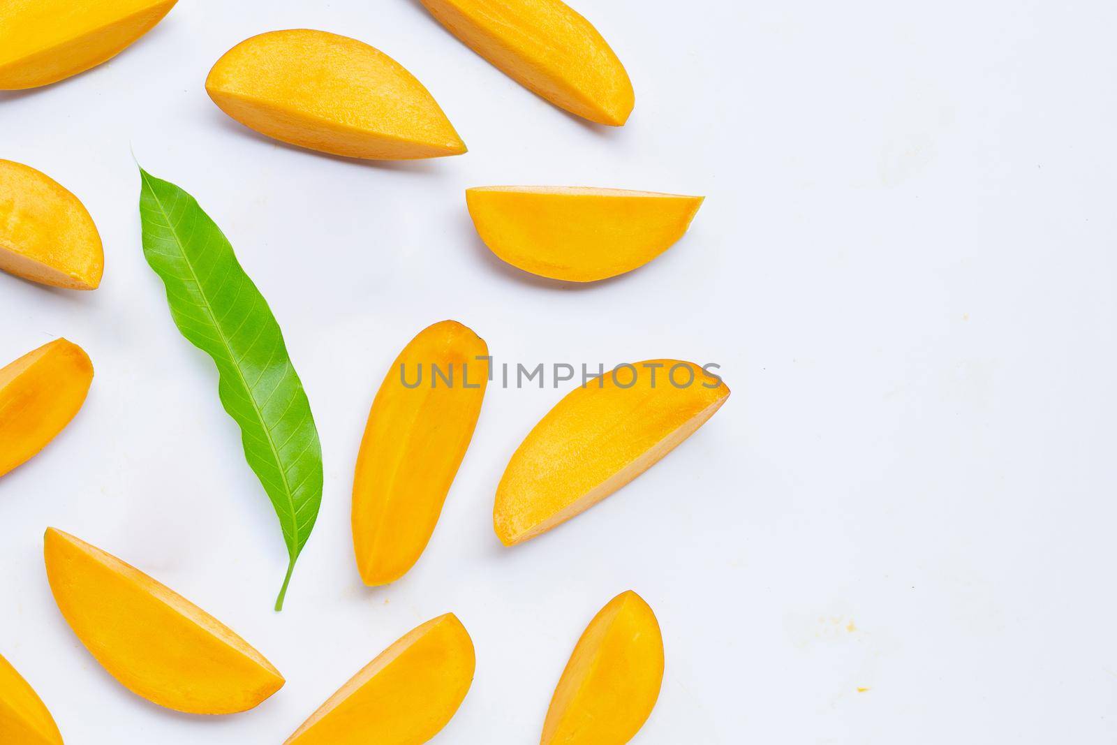 Tropical fruit, Mango slices on white background. Top view