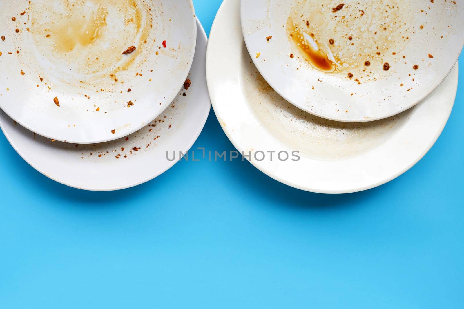 Dirty dish es on blue background. Top view