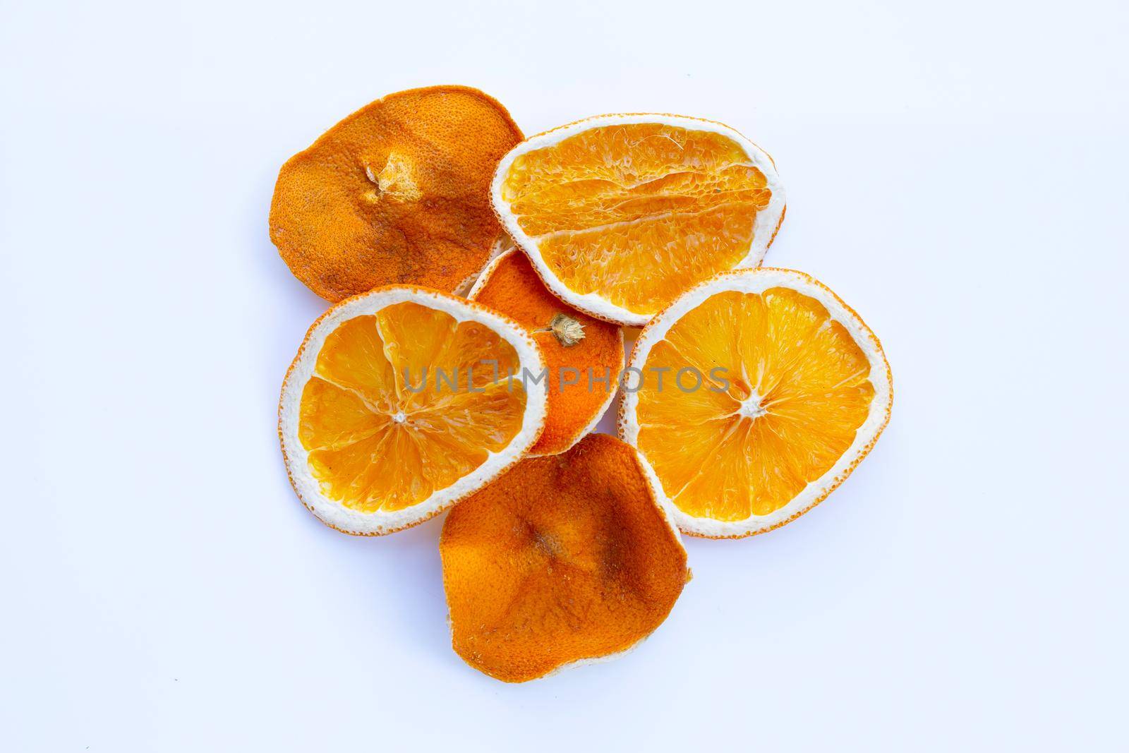 Sliced dry oranges on white background.