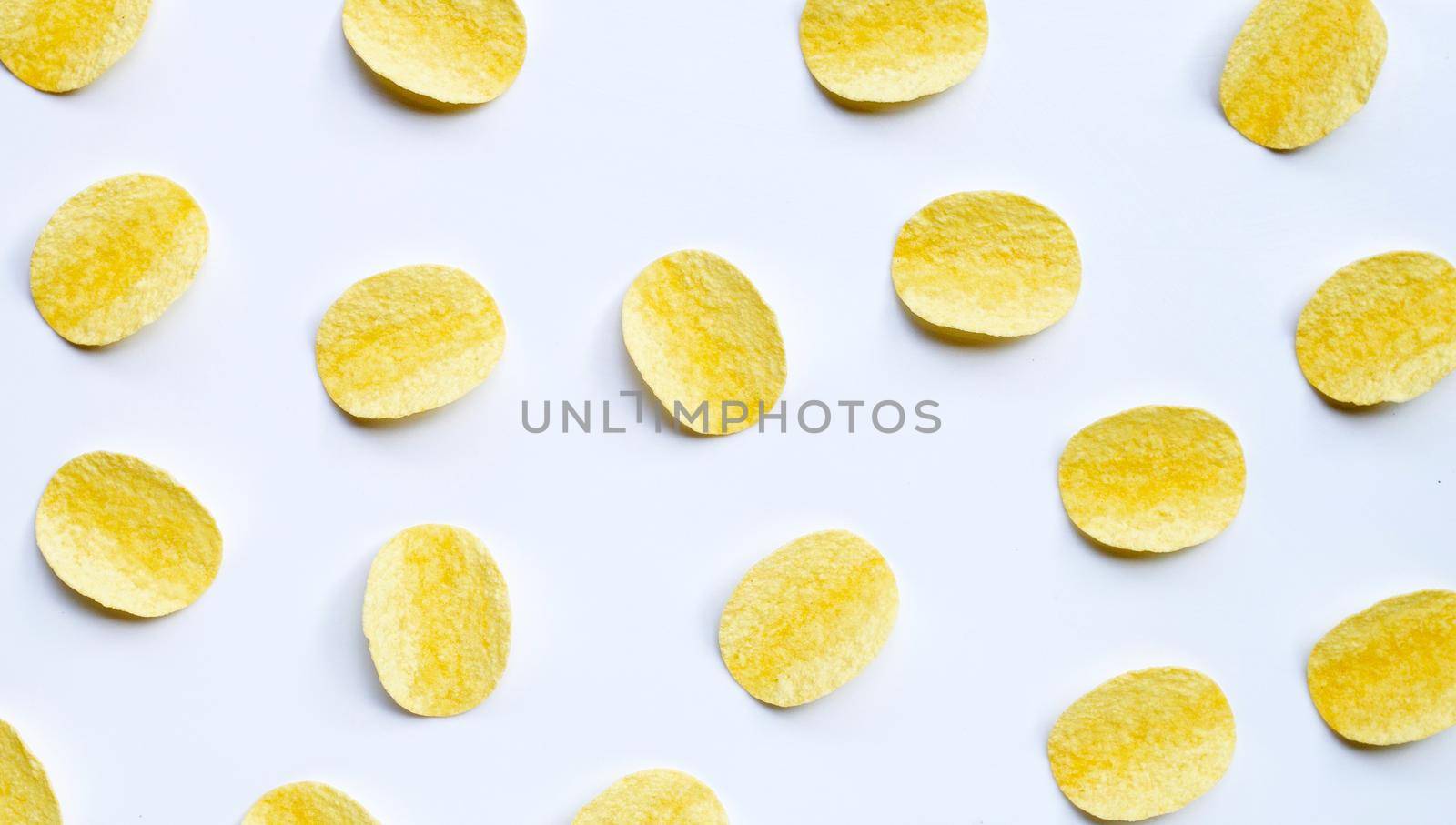 Potato chips on white background. Top view