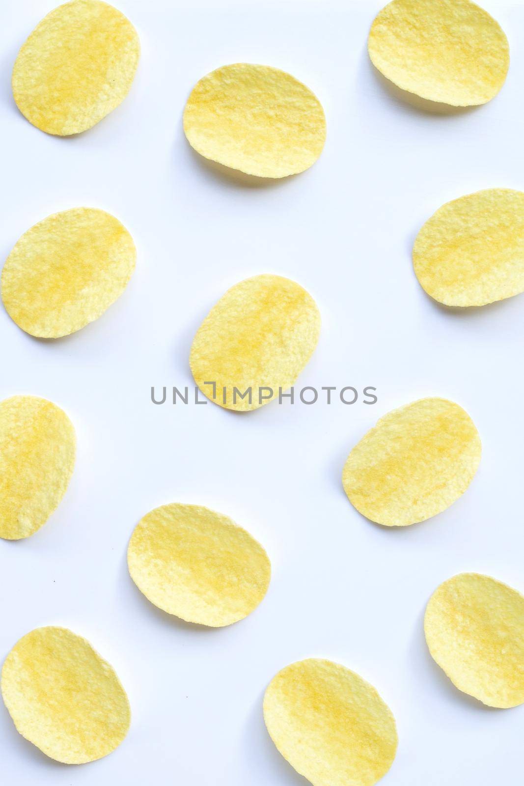 Potato chips on white background. Top view by Bowonpat