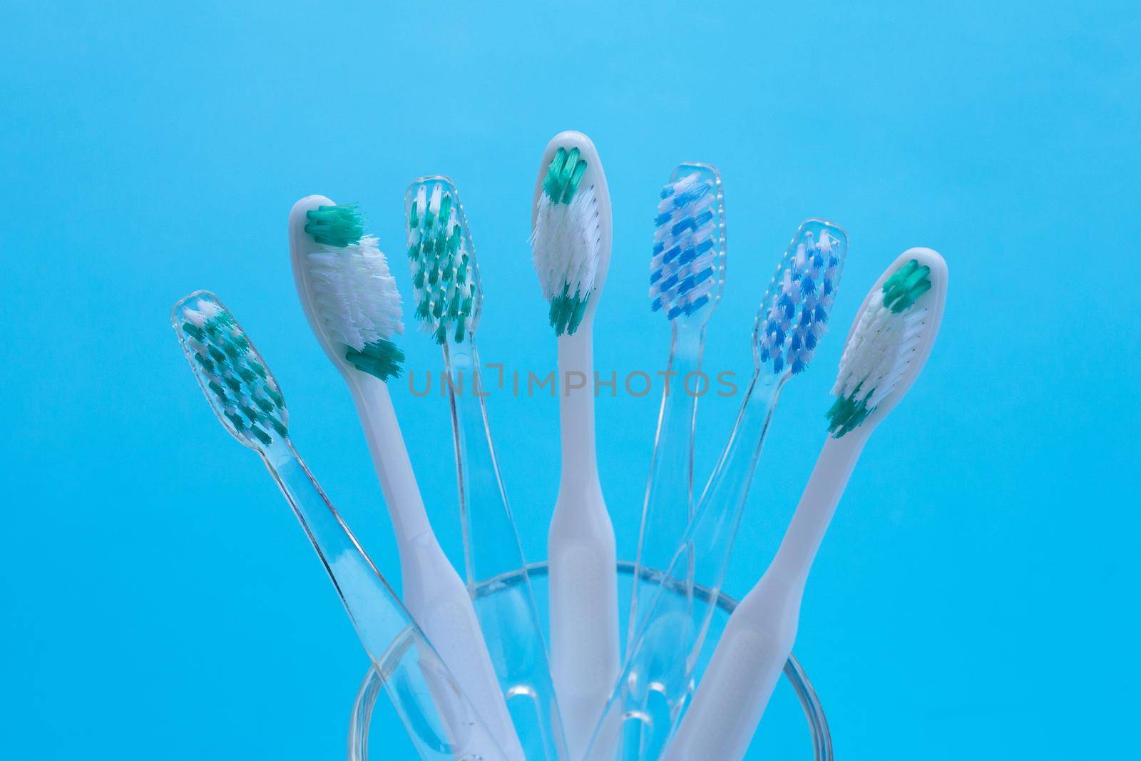 Toothbrushes on blue background. Dental care concept