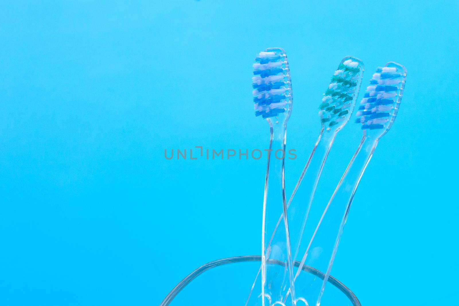 Toothbrushes on blue background. Dental care concept