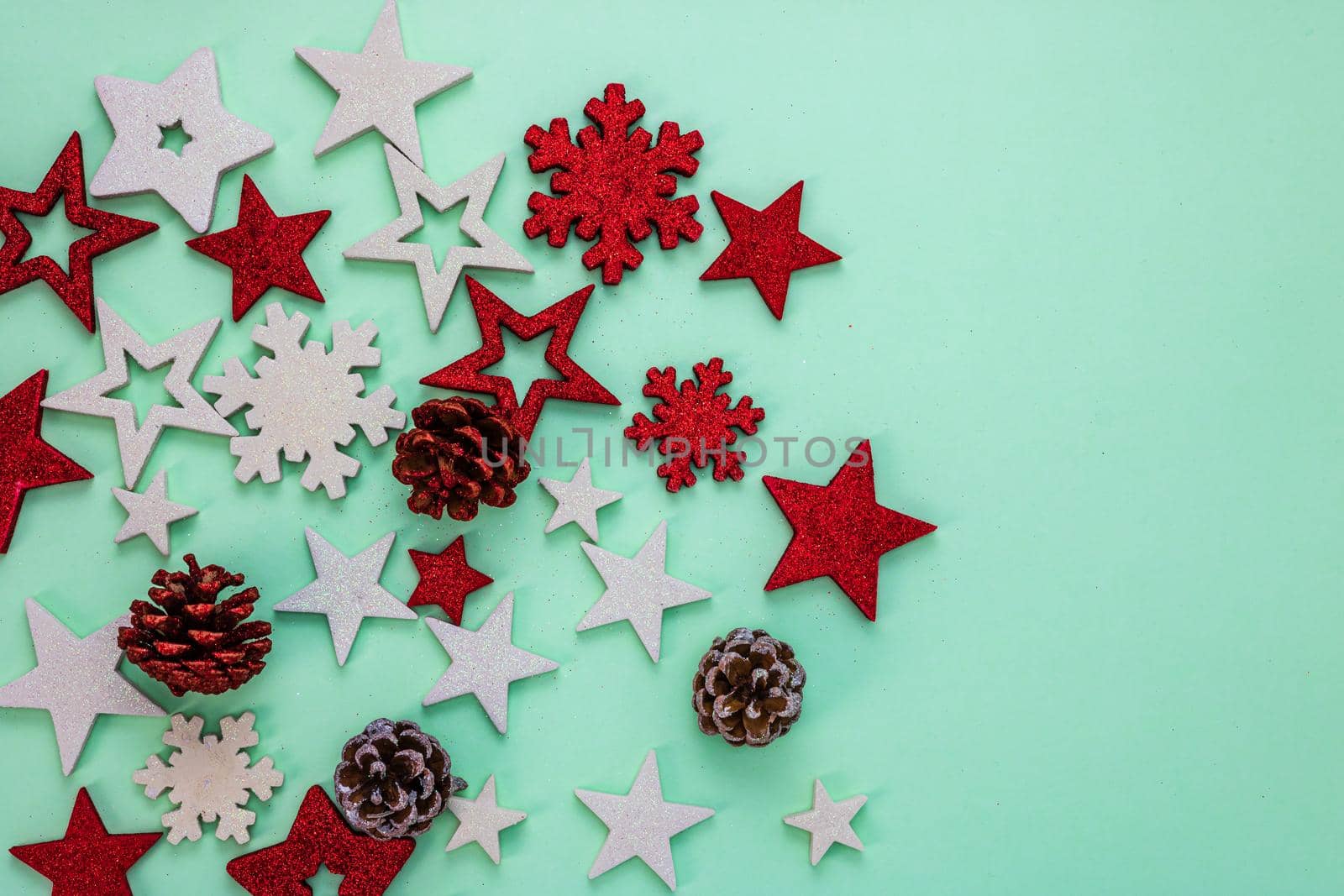 Top view with copy space for december season. Christmas composition with glittery ornaments and decorations.