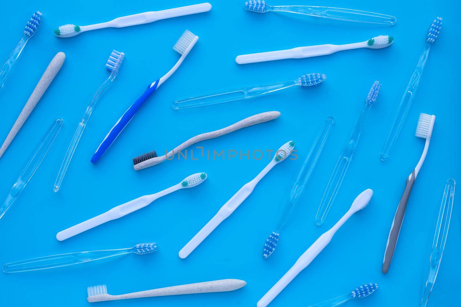 Toothbrushes on blue background. Dental care concept