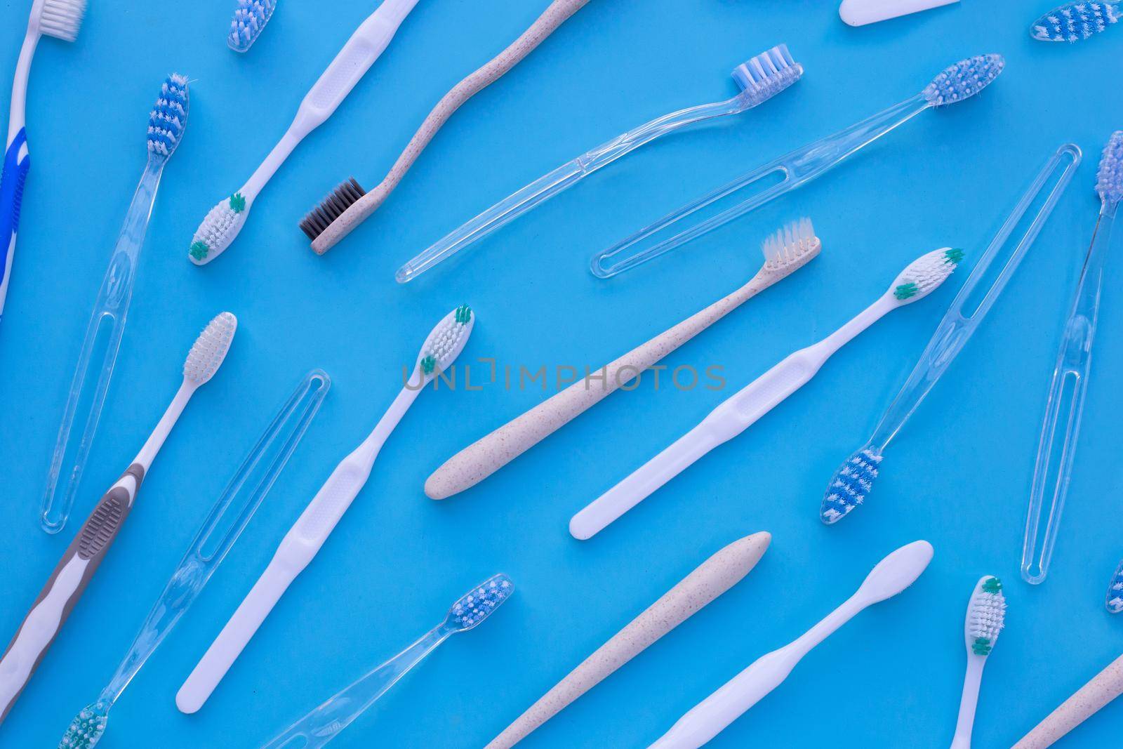 Toothbrushes on blue background. Dental care concept