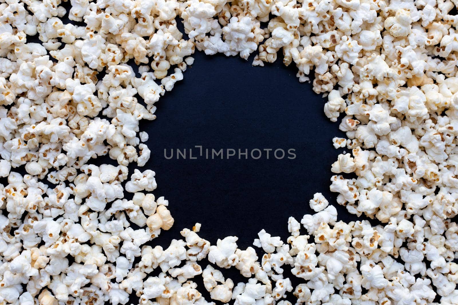 Popcorn on dark background. Copy space