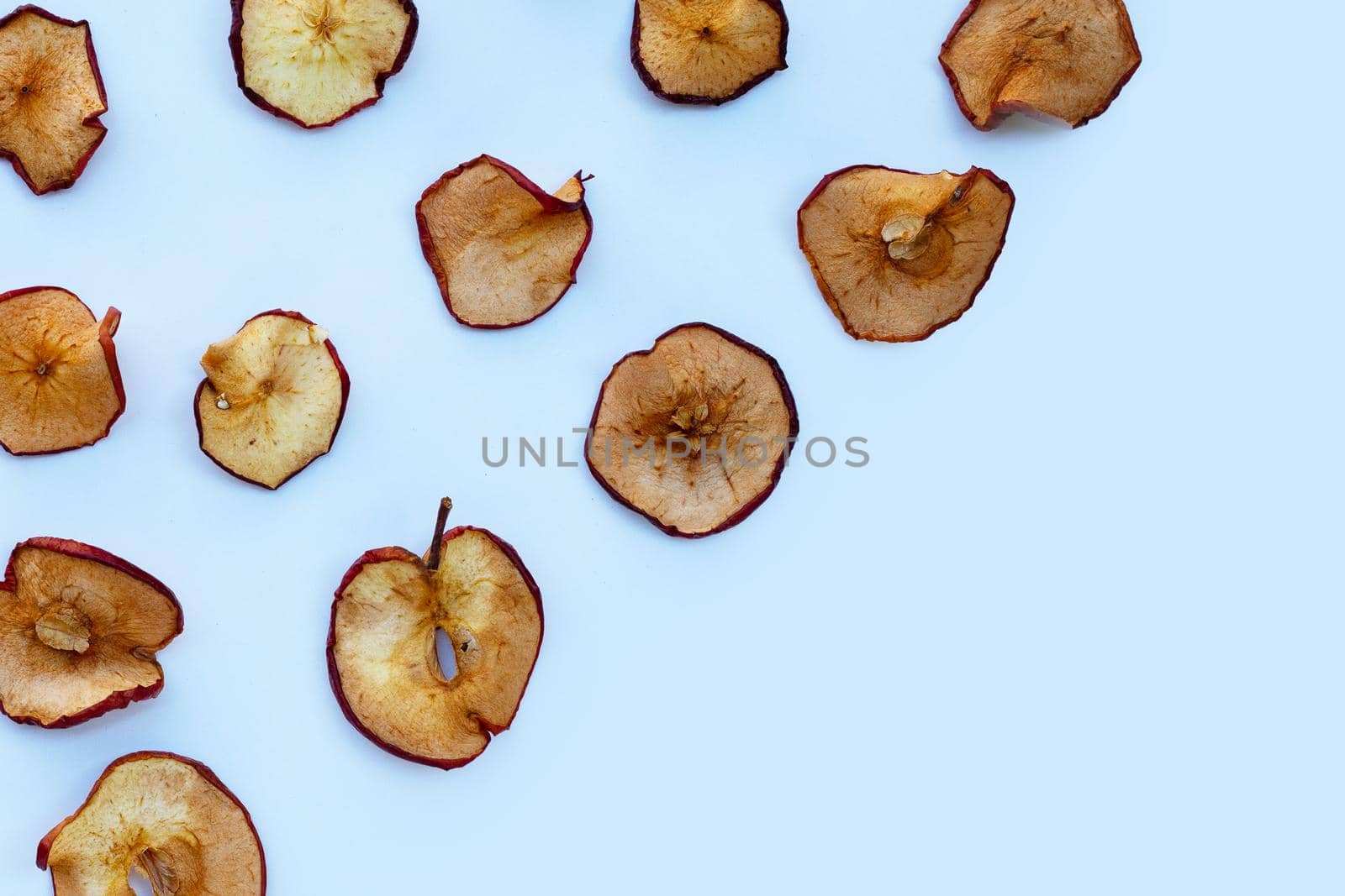 Dried apple slices on white background