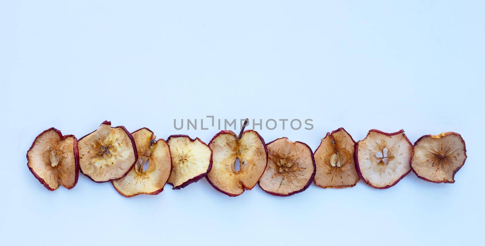 Dried apple slices on white background