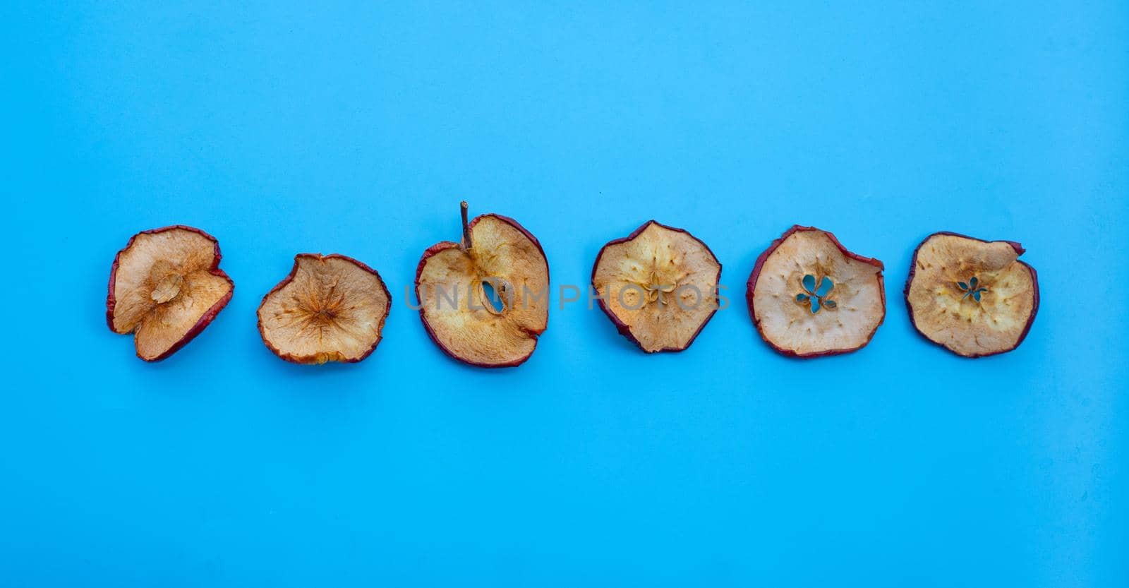 Dried apple slices on white background