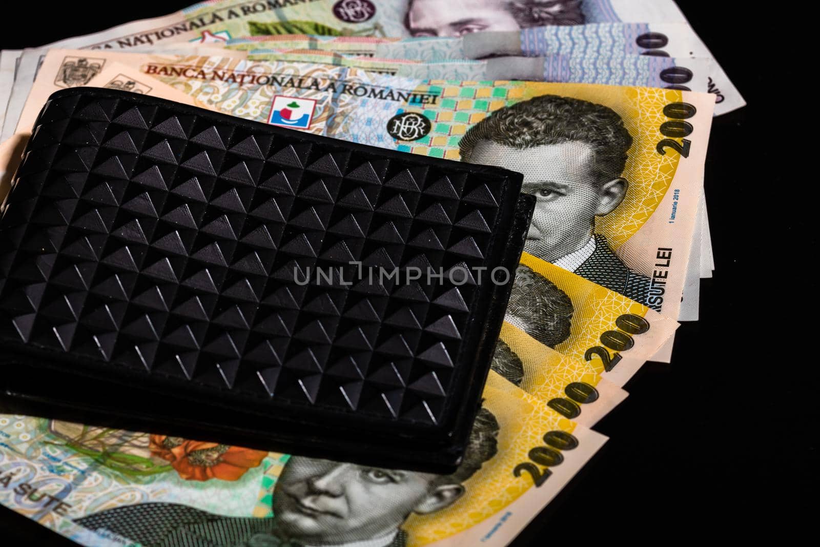 LEI romanian money banknotes in black wallet isolated