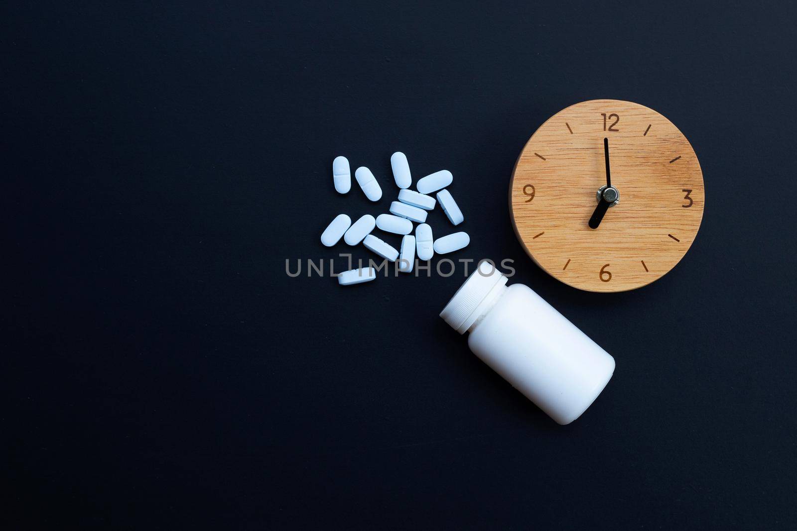 Clock with "PrEP" ( Pre-Exposure Prophylaxis). used to prevent HIV on dark background. Copy space