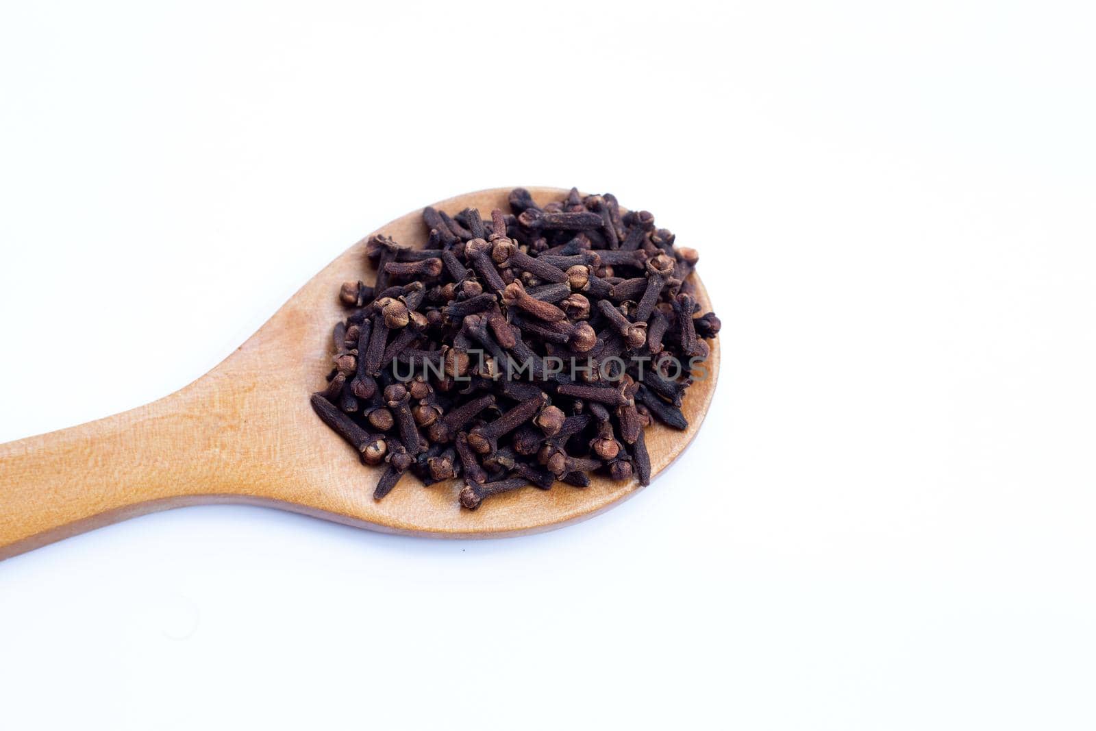 Spice dried cloves on white background.