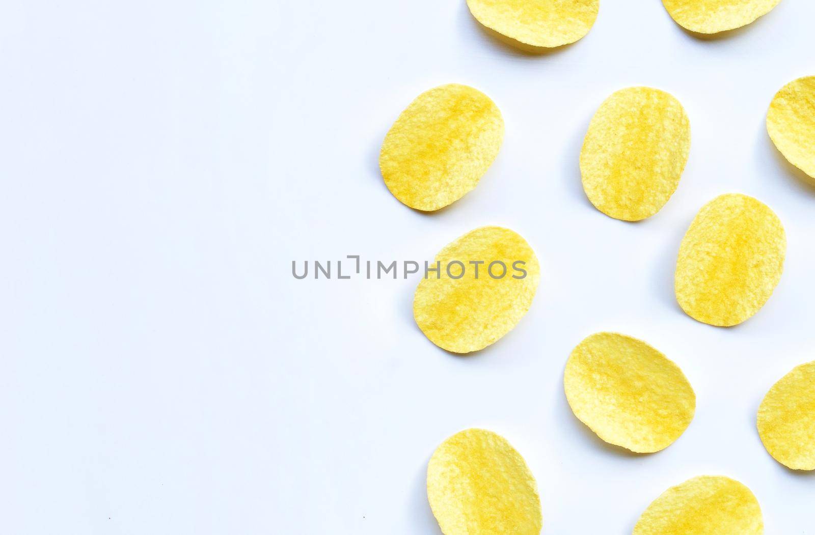Potato chips on white background. Top view