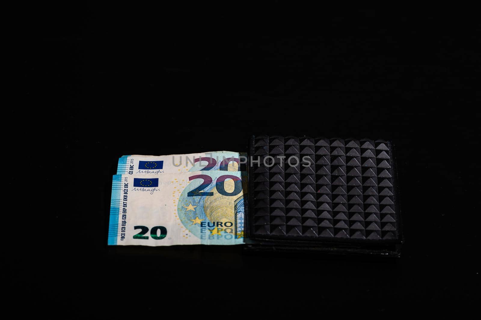 20 Euro money banknotes in black wallet isolated