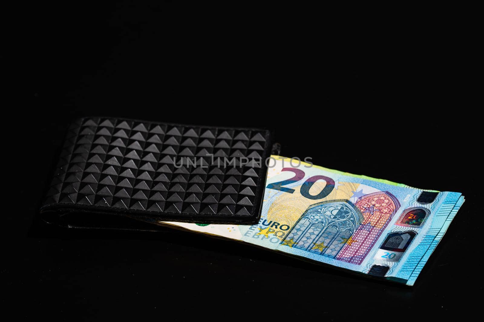 20 Euro money banknotes in black wallet isolated